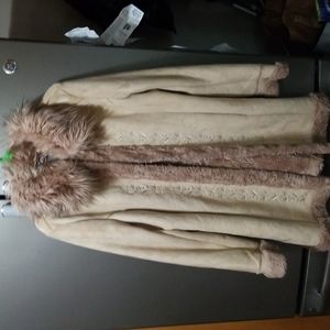 Ladies suede-like coat, with fur collar and furry cuffs. Embroidered design.